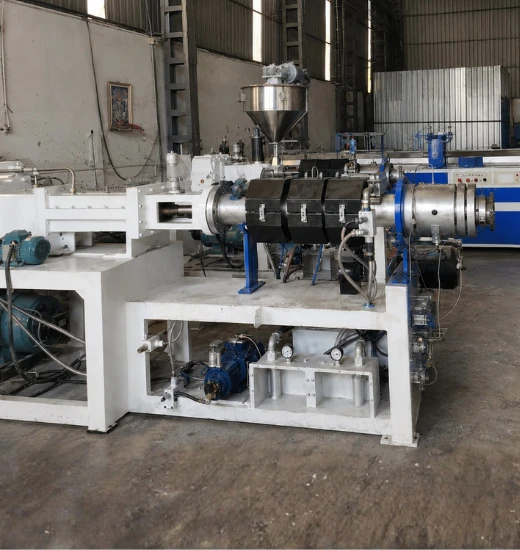 Complete PVC pipe manufacturing machine setup in Ahmedabad plant with extruder, die head, and production line components for PVC pipe manufacturing